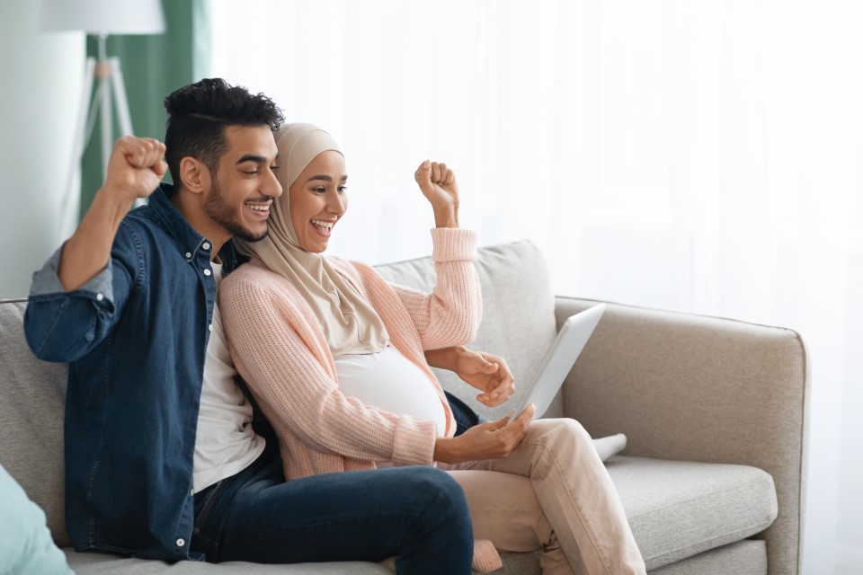 excited-pregnant-muslim-couple-celebrating-key-success-online-sports-betting-live-singapore-malaysia